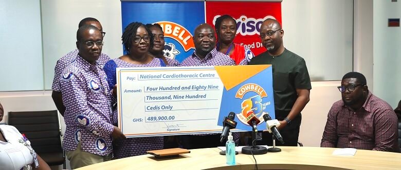 • Mr Tettey (first from right) presenting a cheque to the Cardio team