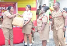 • ACFOI Roberta Ghanson (left) presenting the overall prize to ADOII Windy Ofori-Adjei. Looking on are ADOI Dickson Cofie and ADOII Betty Bradford Photo: Seth Osabukle