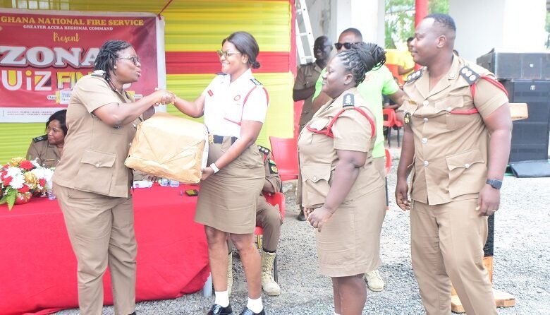 • ACFOI Roberta Ghanson (left) presenting the overall prize to ADOII Windy Ofori-Adjei. Looking on are ADOI Dickson Cofie and ADOII Betty Bradford Photo: Seth Osabukle