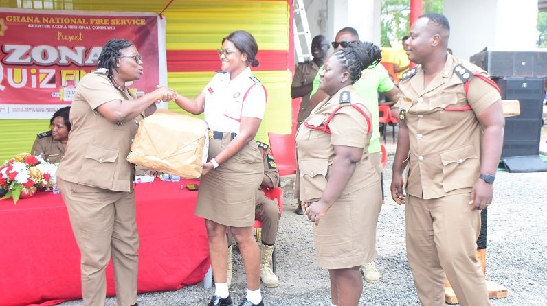 • ACFOI Roberta Ghanson (left) presenting the overall prize to ADOII Windy Ofori-Adjei. Looking on are ADOI Dickson Cofie and ADOII Betty Bradford Photo: Seth Osabukle