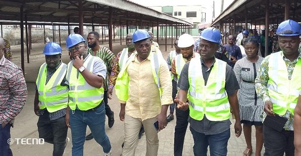 • Mr Martin Adjei-Mensah Korsah (second from right) and the team touring one of the markets