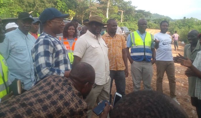 • Mr Francis Asenso Boakye (in hat) with the team inspecting the road