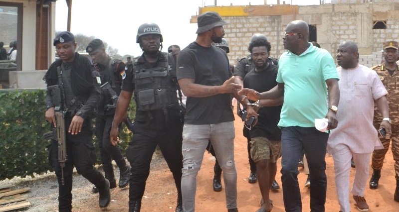 • Mr Titus Glover (second from right) interacting with some of the arrested people. With them are Mr Solomon Kotey Nikoi ( right) and others Photo:Victor A. Buxton