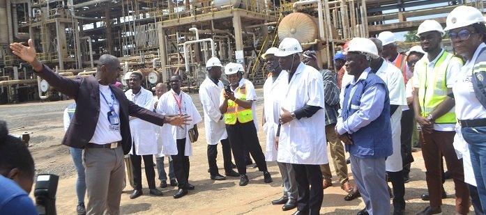 • Mr Herbert Krapa (middle) with Mr Kofi M. Tahoe (fifth from right) and other dignitaries being briefed by an engineer during the tour of TOR Photo Victor A. Buxton