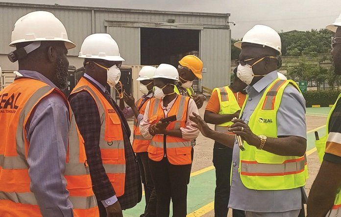 Mr Ennin (right) briefing Dr Krugu and his team in the yard