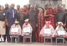 • Mr Andrew Egyapa Mercer (second from right), Odeneho Kwafo Akoto III, (fourth from right) and Mr Akwasi Agyeman (middle) with some guests after the wreath-laying ceremony Photo: Ebo Gorman