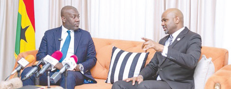 • Kojo Oppong Nkrumah (left) interacting with Thierno Habib Hann, Managing Director of Shelter Afrique