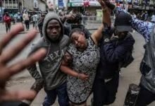 • Businesses have been shut in central Nairobi where this woman was helped after tear gas was fired by police