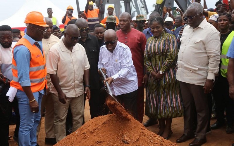 • President Akufo-Addo (with a shovel) cutting sod for the construction of the Adentan-Dodowa road. With him are Mr Francis Asenso Boakye (second from left) and other dignitaries