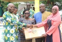 • Nana Obokom Atta IX (left), supported by Mrs Essah-Amoaful, presenting the 2023 WASSCE best student award to Hawawu Kiejembu Abdulai