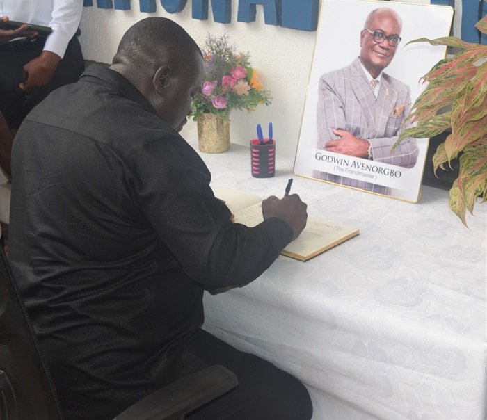 Mr Albert Kwabena Dwumfour signing to officially declare the Book of Condolence open Photo: Stephanie Birikorang