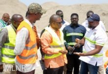 • Mr Kwaku Ampromfi (right) briefing Mr Dukar (middle) and other officials during the visit to the site