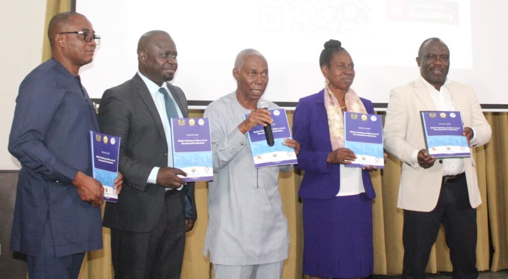 Prof. Kofi Awusabo-Asare (middle), Prof. Samuel K. Annim (second from left), Dr Grace Bediako (second from right) and other dignitaries launching the report Photo: Ebo Gorma