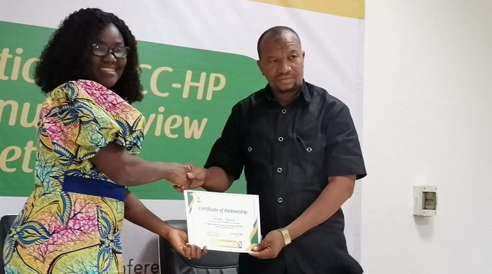 • The Acting Director of HPD, Mrs Mabel Asafo, and a representative of a private-sector organisation displaying the signed MOU