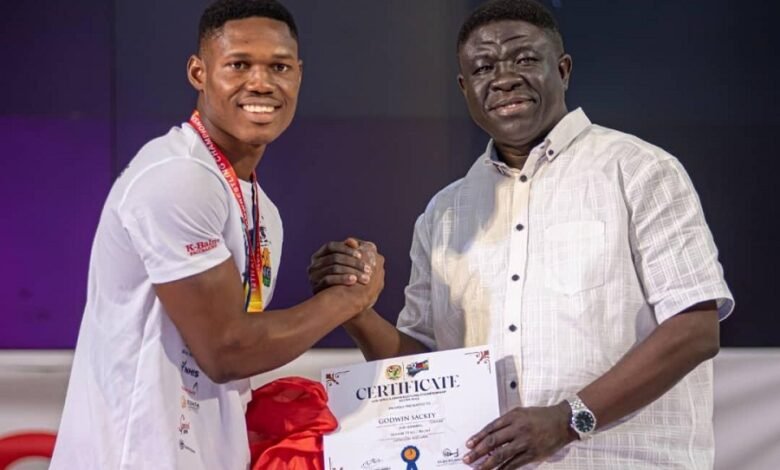 • Godwin Sackey (left) receives a certificate from GAF VIce President, Mr Kofi Addo-Agyekum