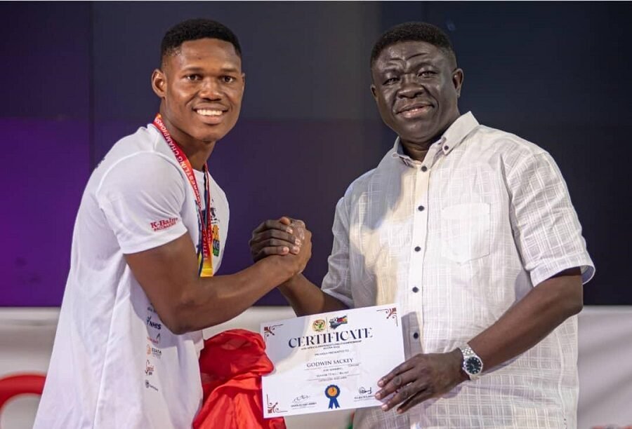 • Godwin Sackey (left) receives a certificate from GAF VIce President, Mr Kofi Addo-Agyekum