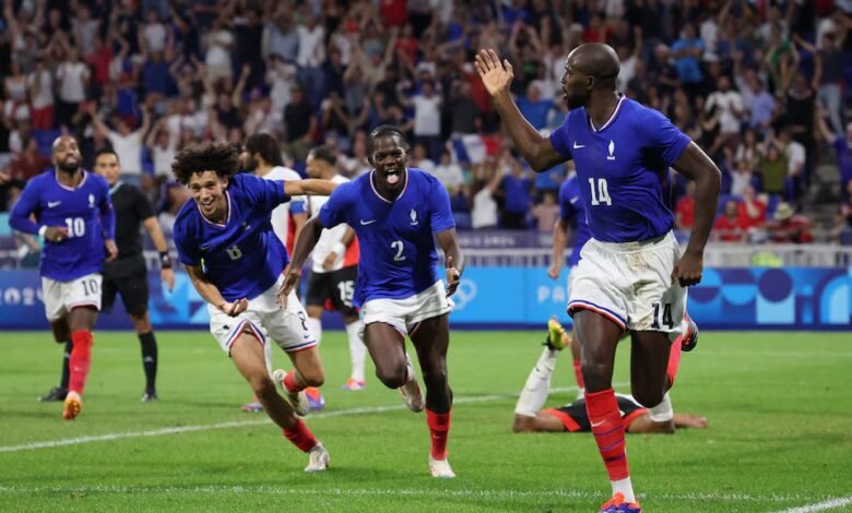 • Jean-Philippe Mateta of France celebrates scoring their second goal with teammates