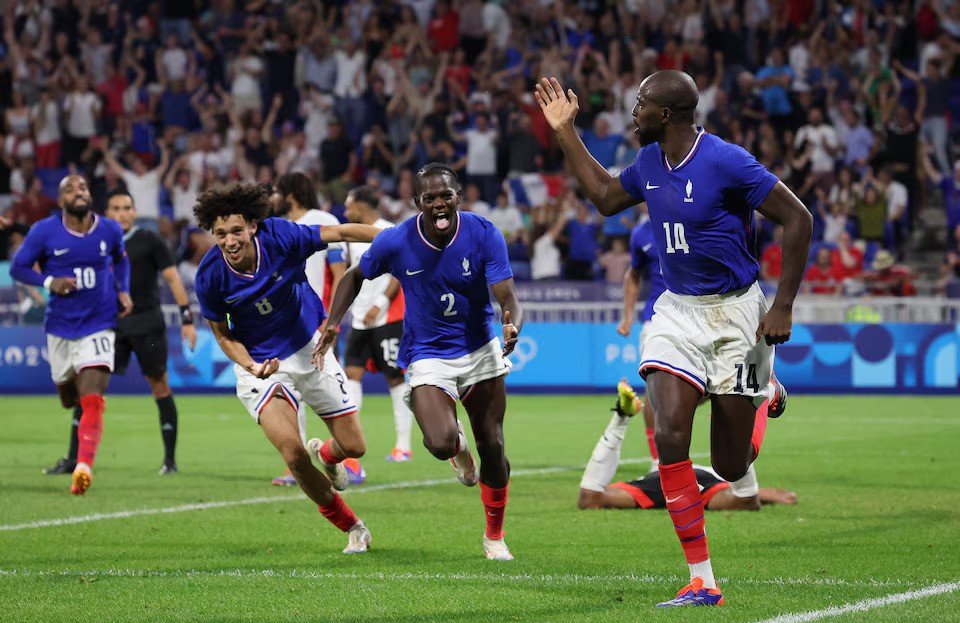 • Jean-Philippe Mateta of France celebrates scoring their second goal with teammates
