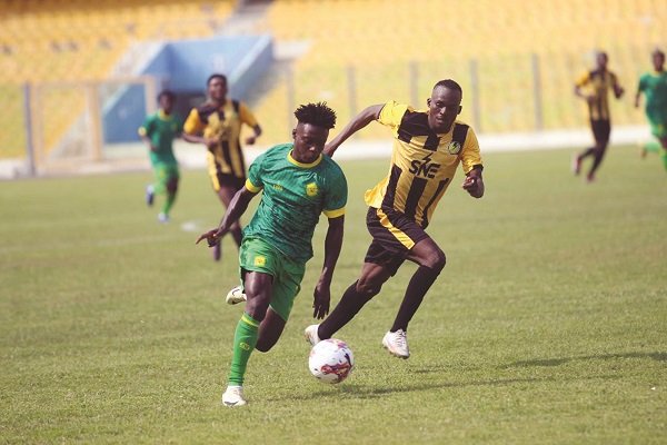 • Kwabena Adu Meider (in green) race past his marker Moral Djimothoum in this scene Photos: Raymond Ackumey