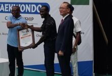 • Mr Lartey Otu (left) receiving the citation from the Vice President of the GTF, Mr Charles Cromwell. Looking on is the Korea Ambassador to Ghana, Mr Park Kyongsig