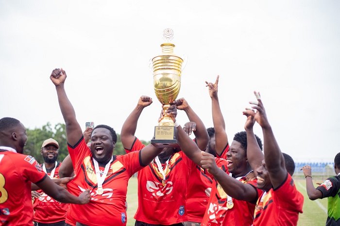 • Players of Bulls RLFC celebrating with their trophy