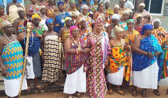 • The Second Lady (middle) with President of Oti Region Queen Mothers Association, Nana Otubea II (fourth from left) and others