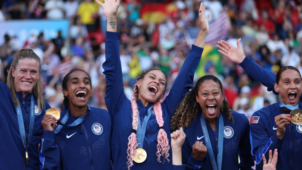 • Members of Team USA celebrate one of their gold medals feat during the Games