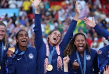 • Members of Team USA celebrate one of their gold medals feat during the Games