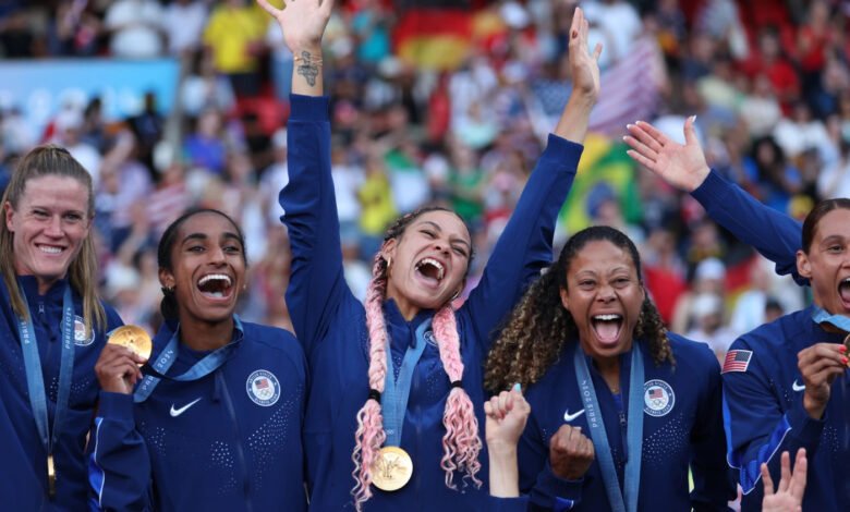 • Members of Team USA celebrate one of their gold medals feat during the Games