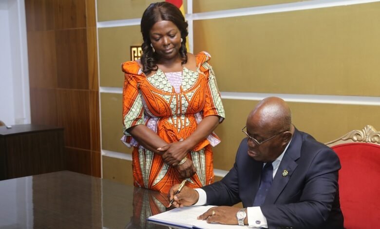 • President Akufo-Addo signing the Presidential Compact on WASH at the Jubilee House. With him is Lydia Seyeram Alhassan, Minister of Sanitation and Water Resources