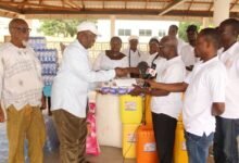 • Mr John Ampaw (second from left) recriving the items from Pastor Frederick Koi Apraku Photo: Ebo Gorman