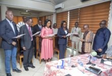 • Mr Yaw Boadu-Ayeboafoh (second from right) swearing in members of the Graphic Board. With him is Mr George Sarpong