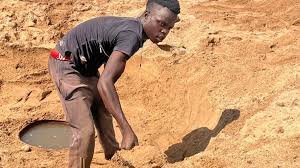 • A resident digging in serach of water