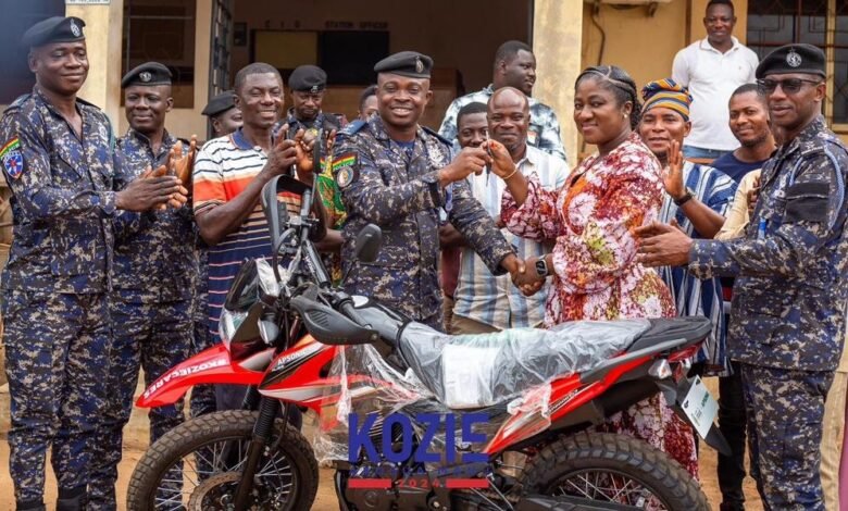 • Ms Akosua Asaa Manu presenting the keys of the motorcycles to Chief Superintendent Richard Boateng