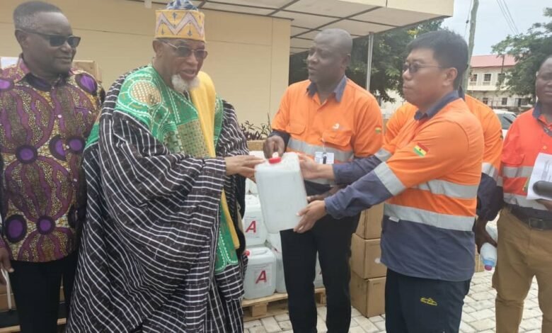 Mr. Feng Baoli (right), making a presentation of the medical consumables, Dialysis machine to the the Paramount Chief of the Talensi Traditional Area, Naba Kubilsong Namalteng (left)