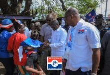 • Dr Bawumia (second from right) interacting with some community members at Kpone