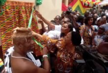 • Mrs Rebecca Akufo-Addo being assisted by Ga Mantse, Nii Tackie Tsuru II, to cut the tape to hand over the schools