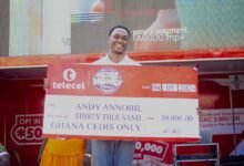 • Mr Annobil displaying his cheque