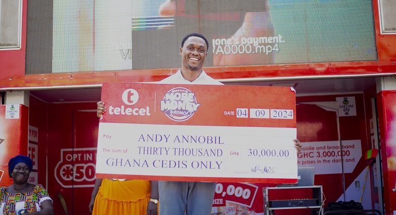 • Mr Annobil displaying his cheque