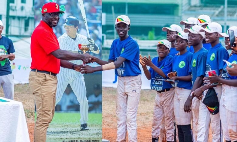 • Mr. Danso presenting the winner’s trophy to Team Greater Accra