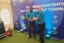 • Mr Mawuko Afadzinu, Head, Brands and Marketing of Stanbic Bank, Ghana awards a winner