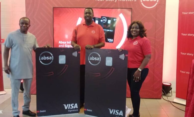 • Mr Nyaletey (left) with some management staff of the Bank displaying the dummy cards