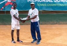 • Mr Peter Annan presenting a certificate to the boys U-14 winner Jeff Frimpong