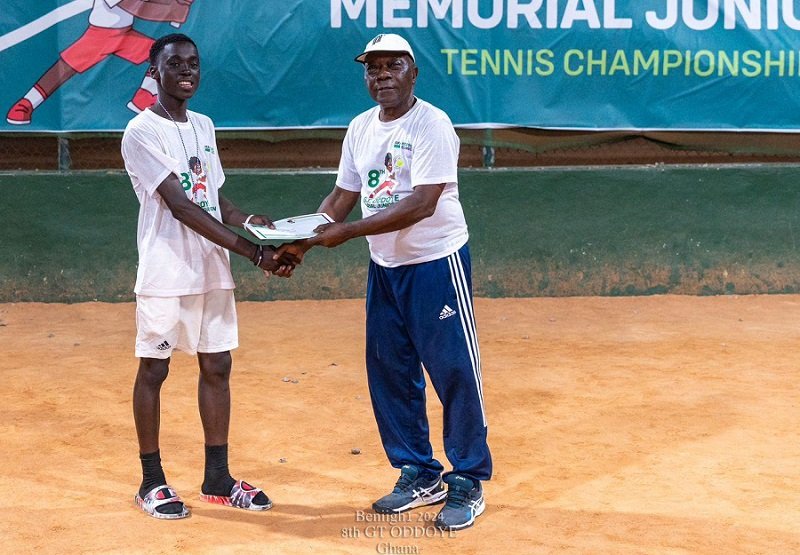 • Mr Peter Annan presenting a certificate to the boys U-14 winner Jeff Frimpong