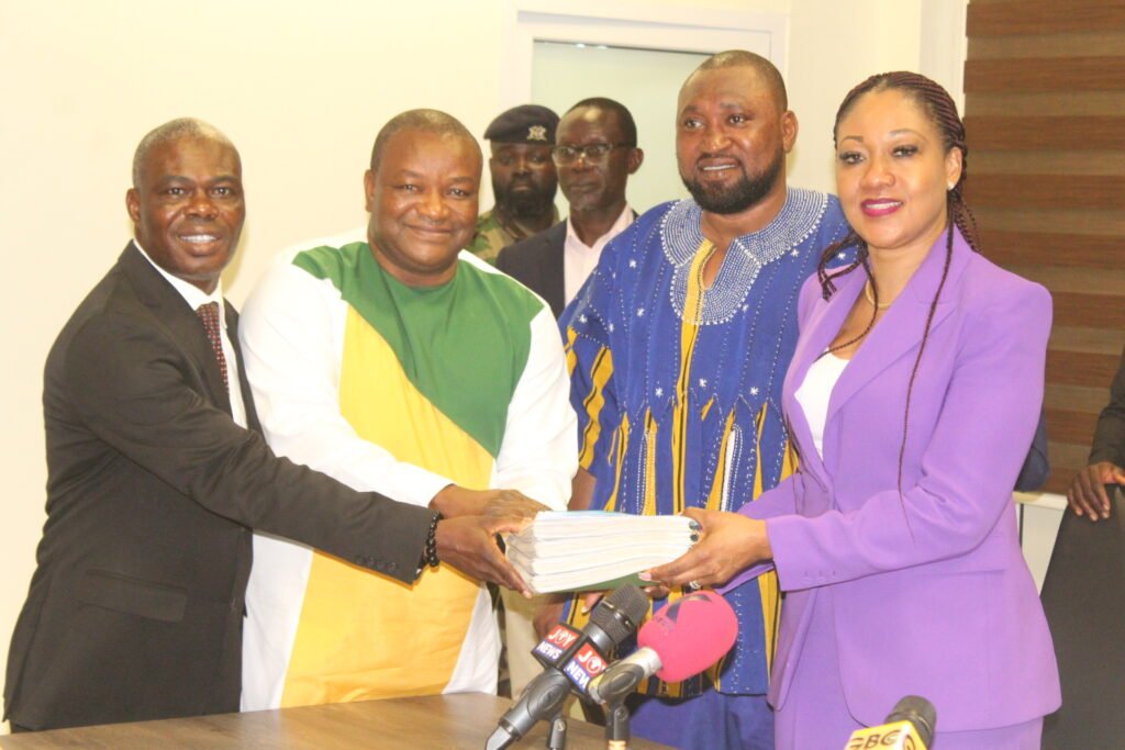 • Mrs Jean Mensa (right) receiving forms from Dr Hassan Ayariga of APC and his running mate