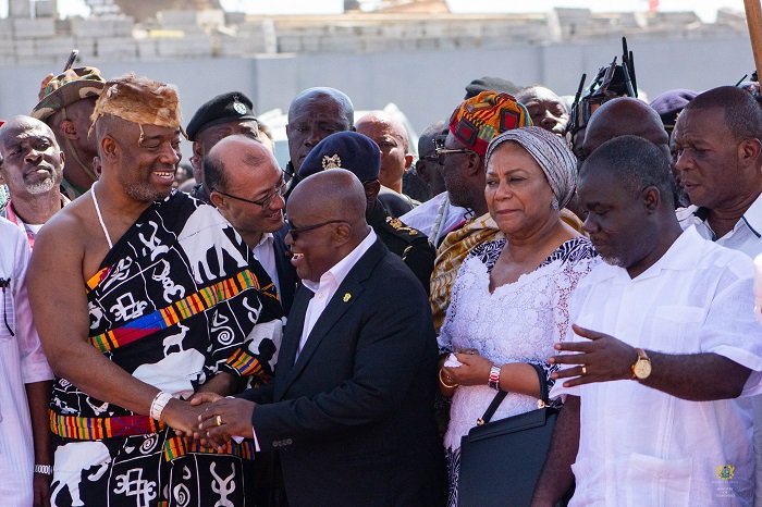 President Akufo-Addo (middle) being assisted by King Tackie Teiko Tsuru II, Ga Mantse (third from left) and other dignitaries to cut the tape to inaugurate the Jamestown Fishing Habour in Accra