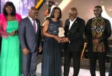 • Mrs Delese Mimi Darko (middle), CEO, FDA, receiving the overall Specified Entity of the Year award from President Akufo-Addo