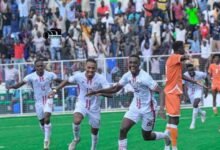 • Striker Eisa (arrowed) leading the celebrations after scoring