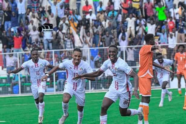 • Striker Eisa (arrowed) leading the celebrations after scoring