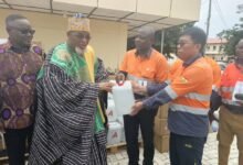 Mr Feng Baoli (right), presenting the medical consumables, dialysis machine to the, Naba Kubilsong Namalteng, Paramount Chief of the Talensi Traditional Area